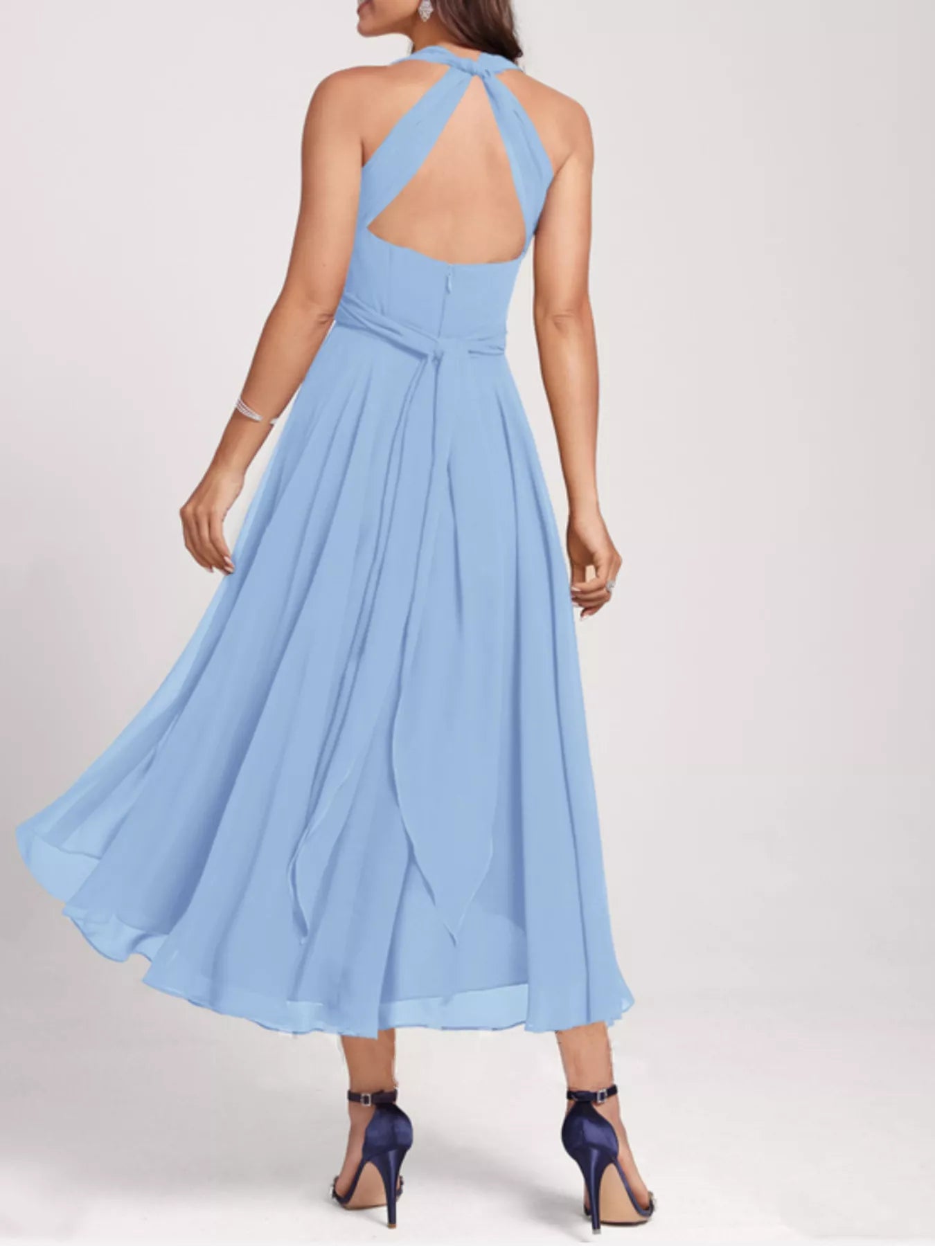 Light blue dress with open back on a white background