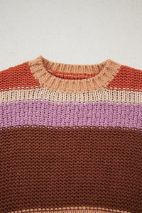 Knitted sweater with color-blocked design on a light background