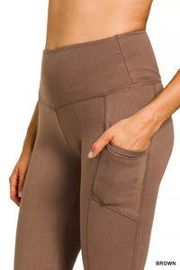 Brown leggings with pockets on a white background