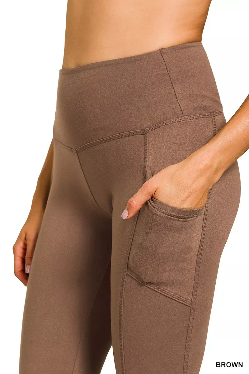 Brown leggings with pockets on a white background