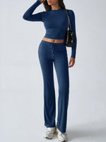Person wearing a blue matching set with a white background