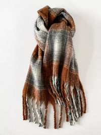 Plaid scarf with brown and gray pattern on a white background