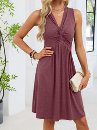 Woman wearing a maroon dress with a white background