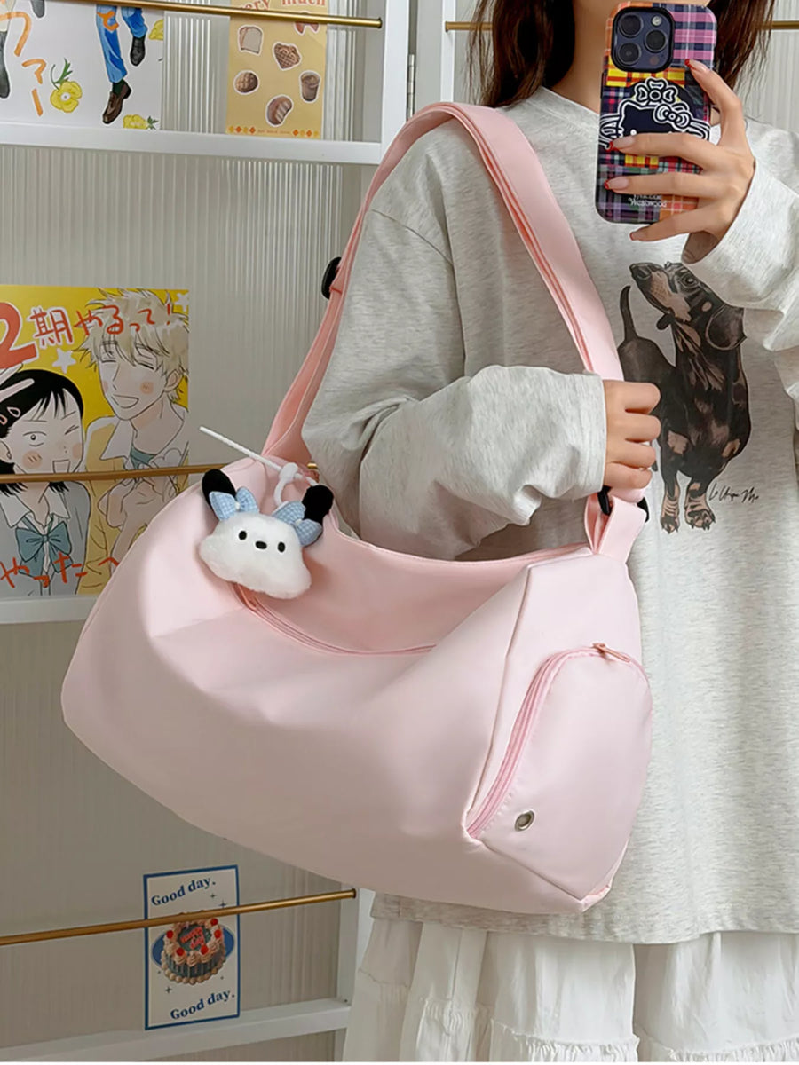 Person holding a pink bag with a cow plushie, standing in front of a wall with posters.