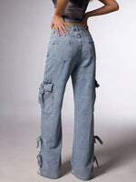 Person wearing light blue cargo pants on a plain background