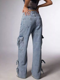 Person wearing light blue cargo pants on a plain background