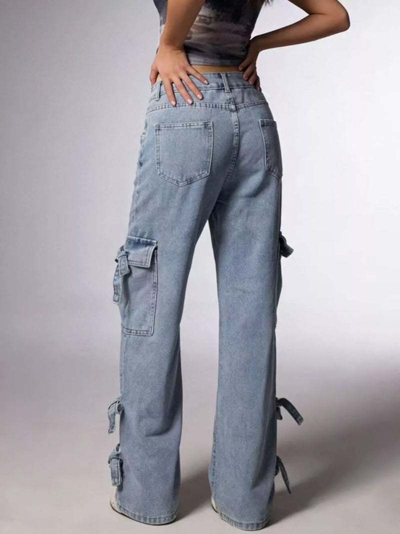 Person wearing light blue cargo pants on a plain background