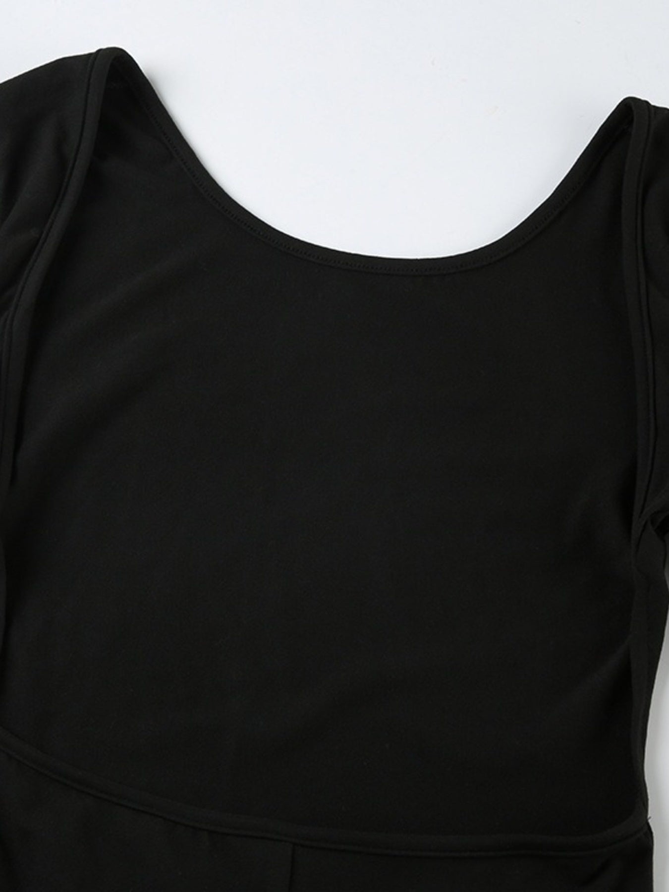 Black dress with a fitted bodice on a white background