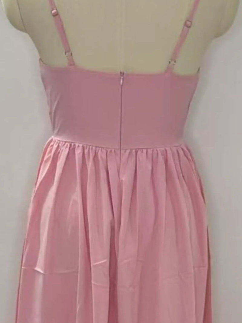 Pink dress on a mannequin against a white background