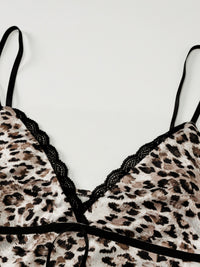 Leopard print bra with black lace trim on a white background