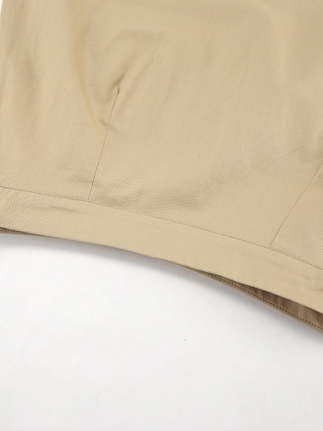 Close-up of beige fabric on a white background