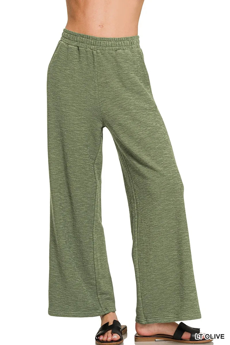 Light olive green pants on a white background