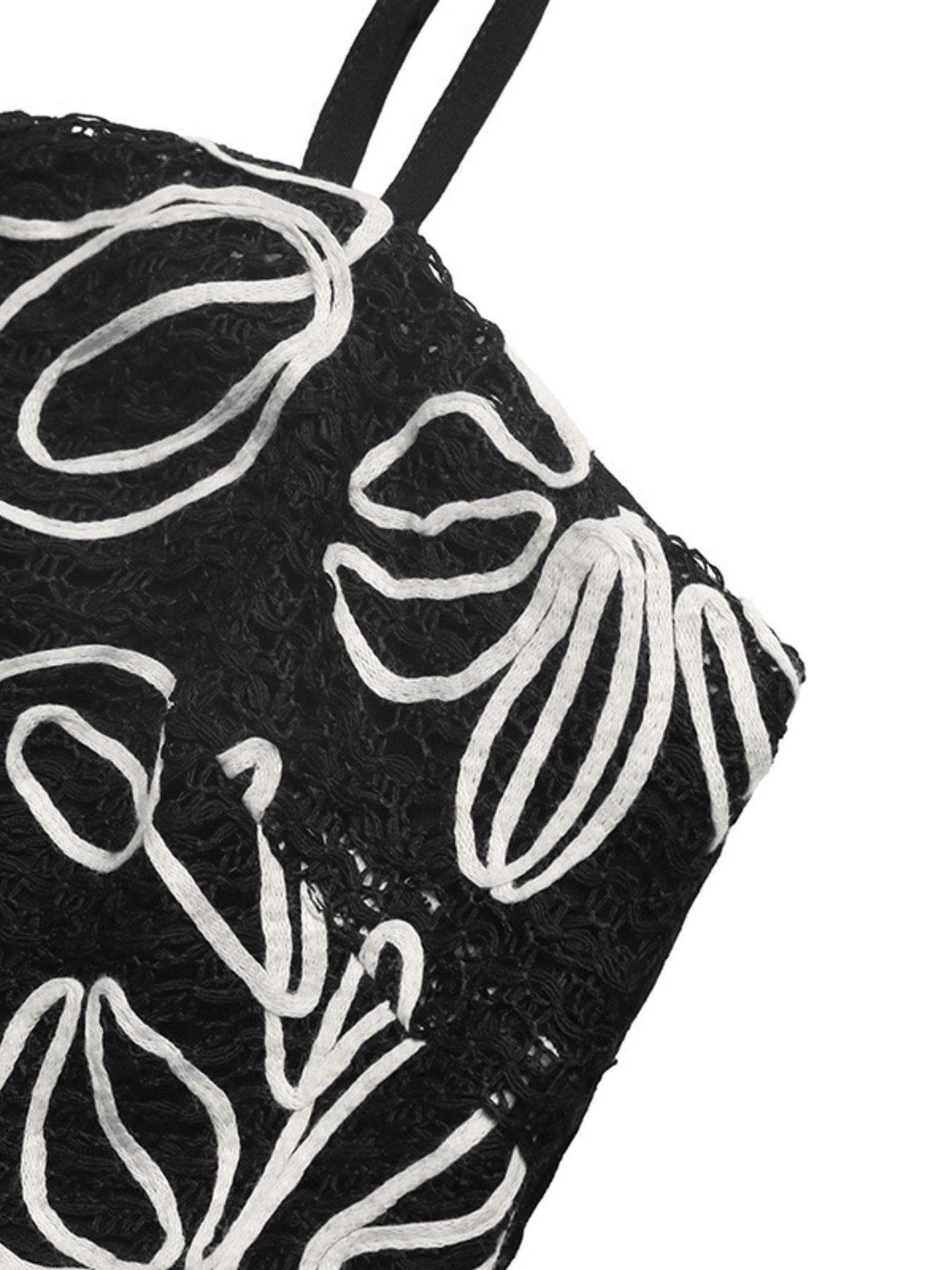 Black pouch with white floral patterns on a white background