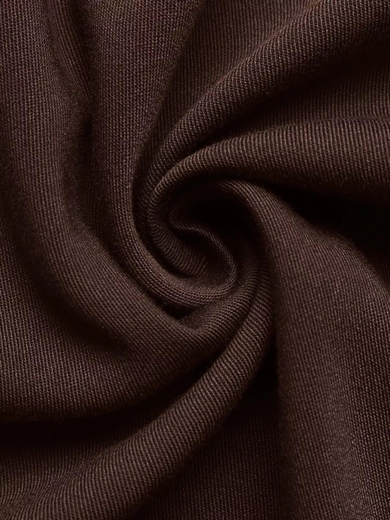 Close-up of brown fabric with folds