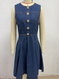Blue denim dress on a mannequin against a white background