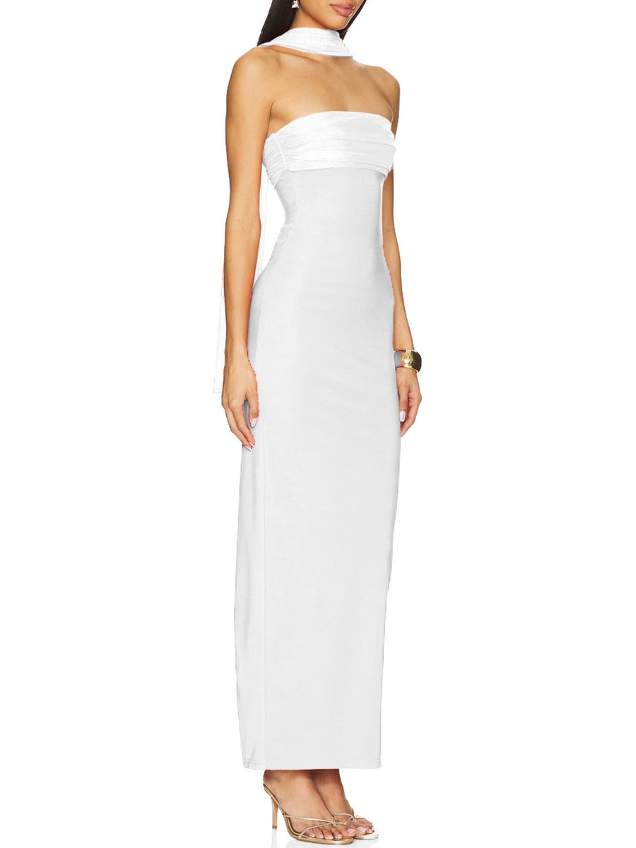 Woman wearing a strapless white evening gown on a white background