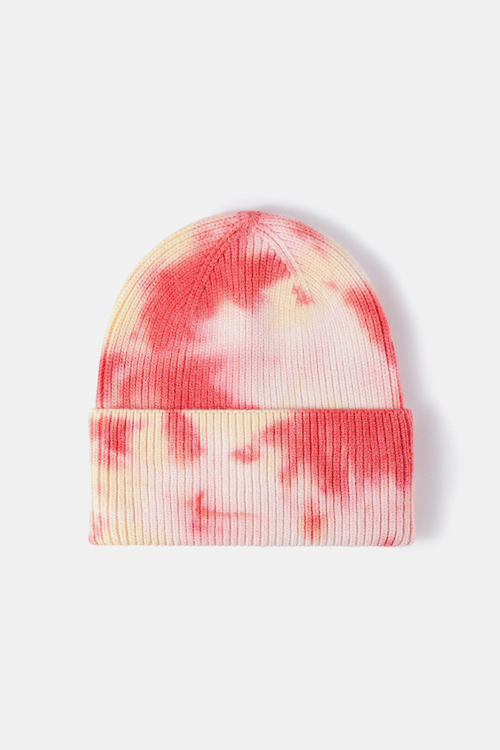 Tie-dye beanie with pink and yellow patterns on a white background
