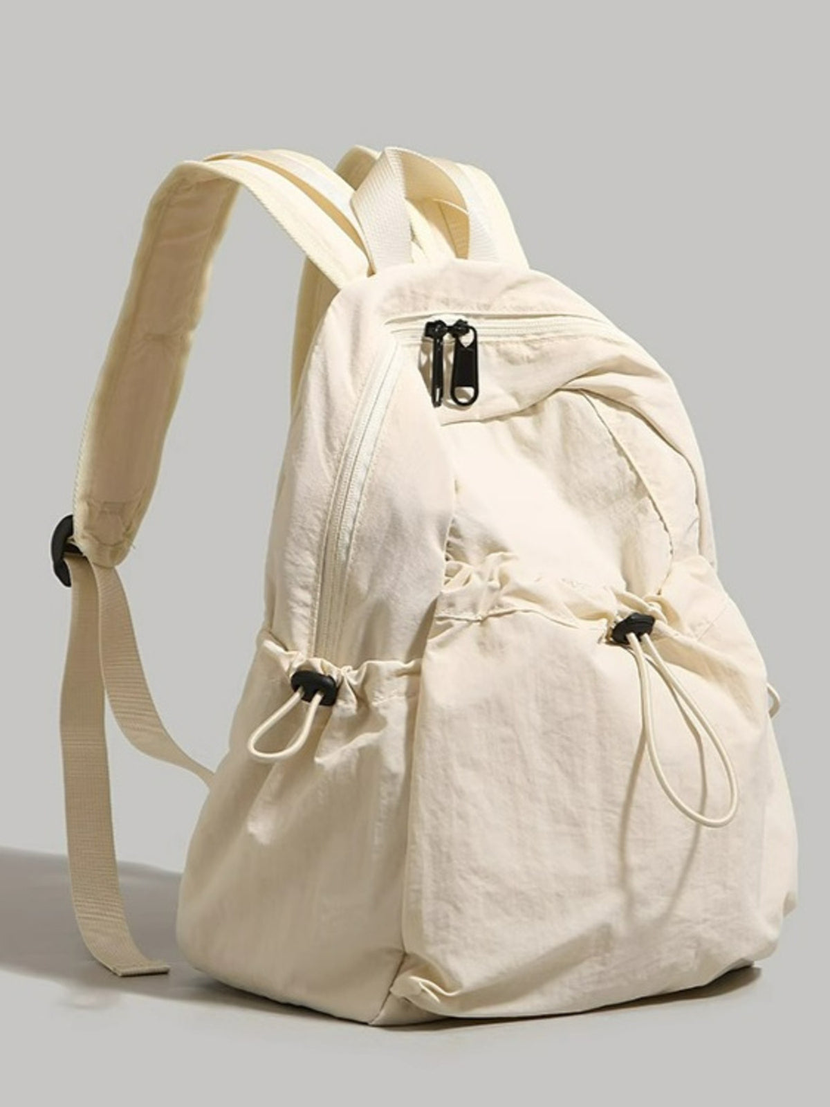 Beige backpack on a light gray background