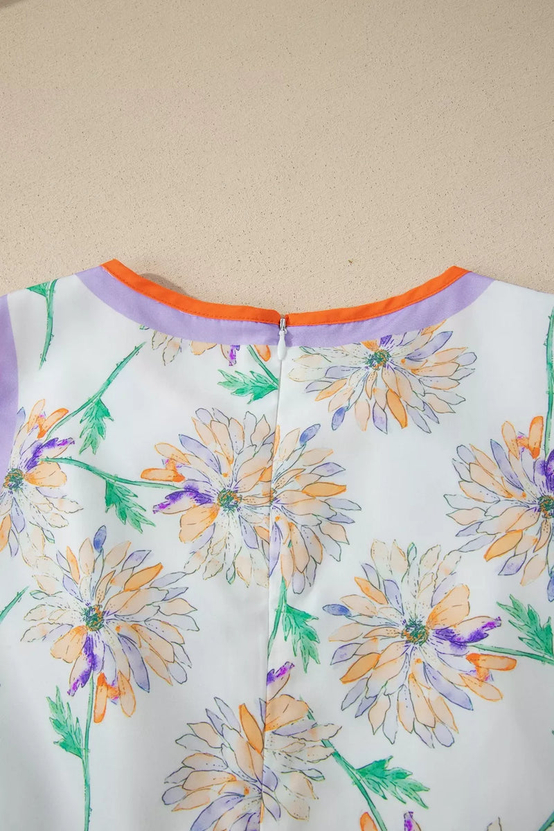 Floral-patterned garment with colorful flowers on a plain background