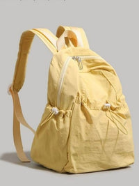 Yellow backpack on a gray background