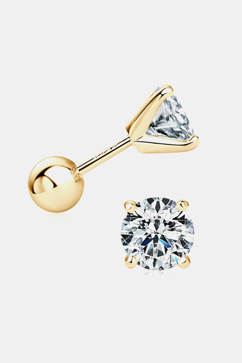 Gold stud earrings with clear gemstones on a white background