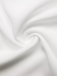 Close-up of white fabric with folds