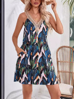 Woman wearing a colorful tropical pattern dress with a blurred background