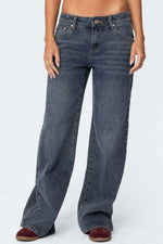 Blue jeans worn by a person on a white background