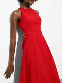 Red dress worn by a model against a white background