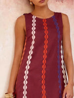 Maroon sleeveless dress with colorful geometric patterns on a plain background