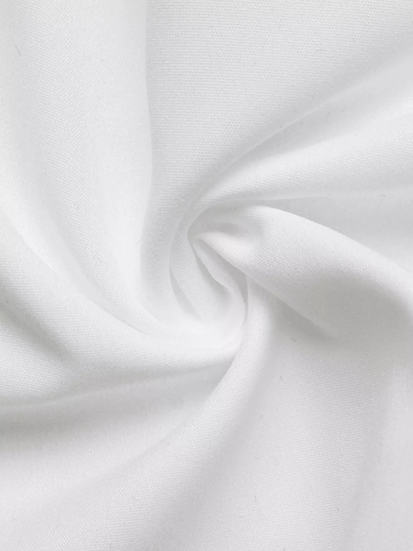 Close-up of white fabric with folds