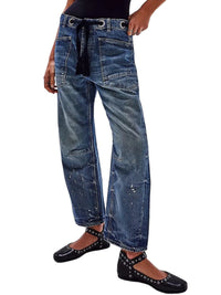 Blue jeans worn by a person on a white background