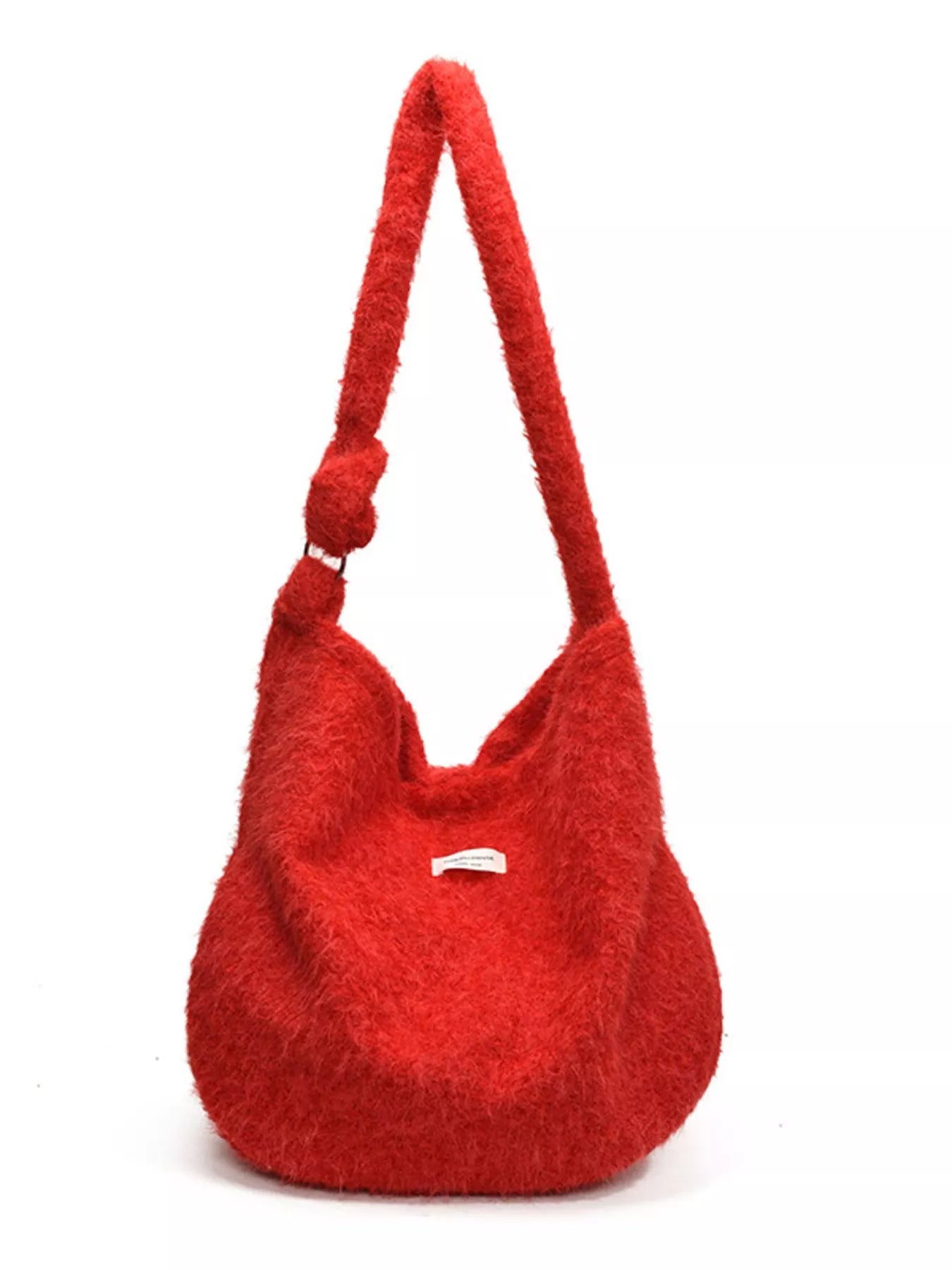 Red textured handbag with a handle on a white background
