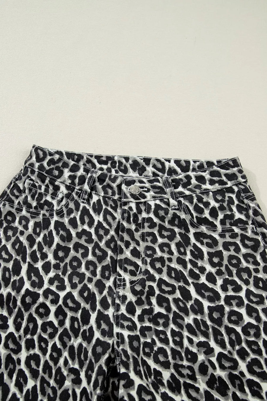 Leopard print pants on a light background