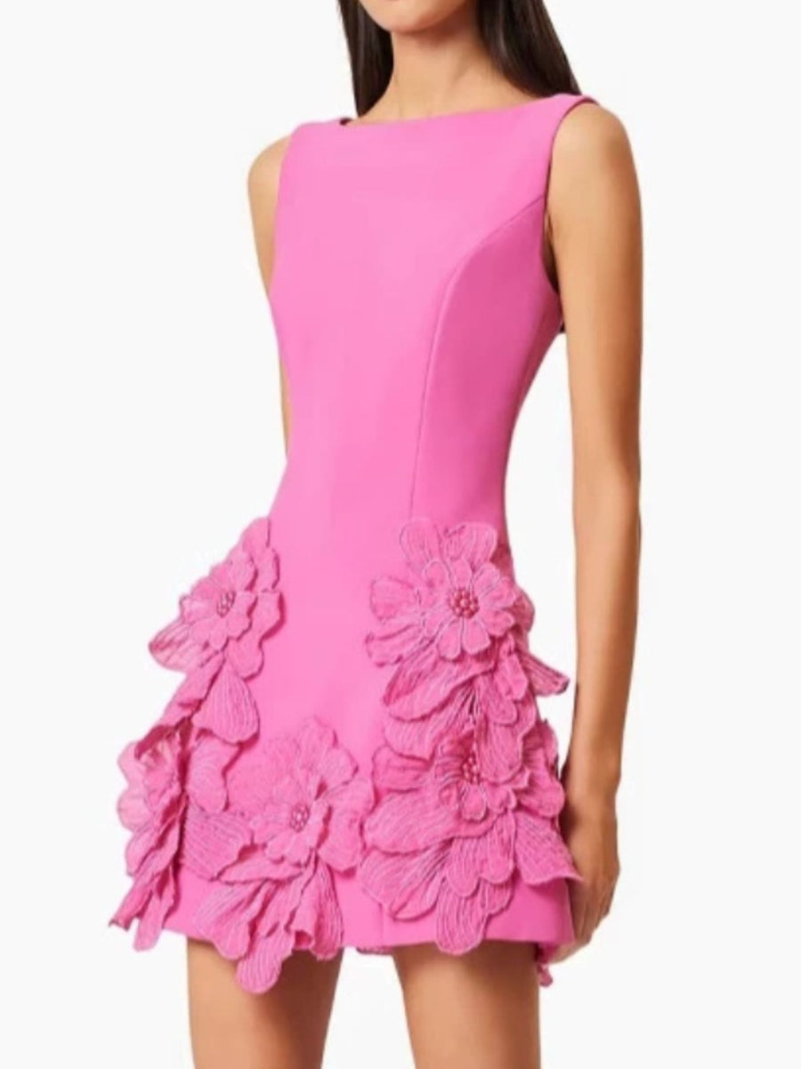 Pink dress with floral details on a white background