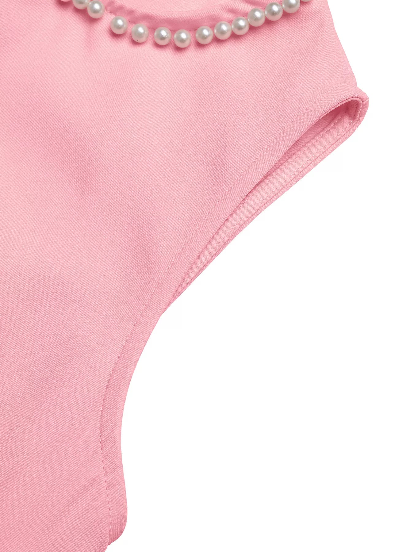 Pink swimsuit with pearl details on a white background