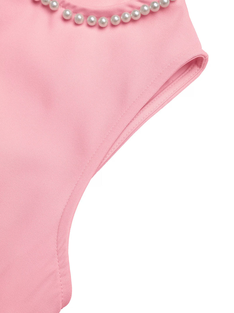 Pink swimsuit with pearl details on a white background