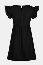 Black dress with ruffled sleeves on a light gray background