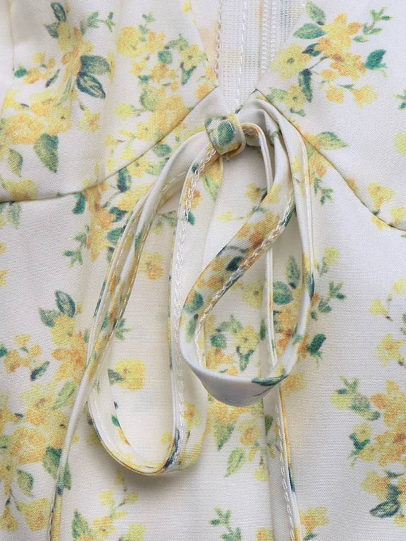 Floral-patterned fabric with a white strap on a matching floral background