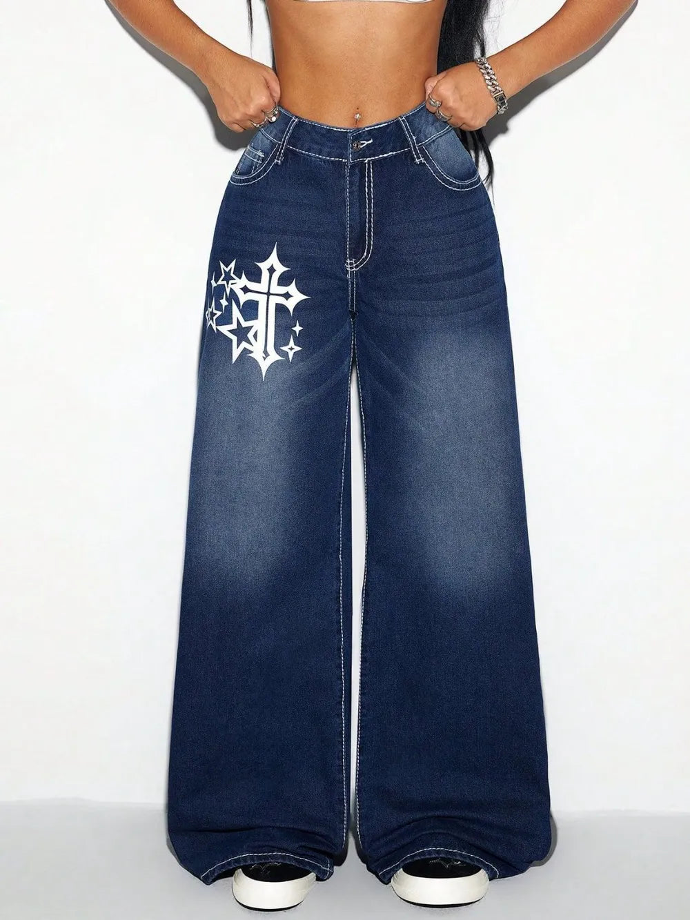 Wide-leg jeans with a star and cross design on a white background