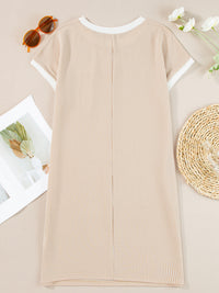 Beige ribbed dress on a neutral background with sunglasses and flowers.