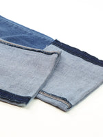 Close-up of denim fabric with a white background