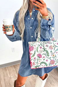 Person holding a floral bag and a Starbucks cup indoors