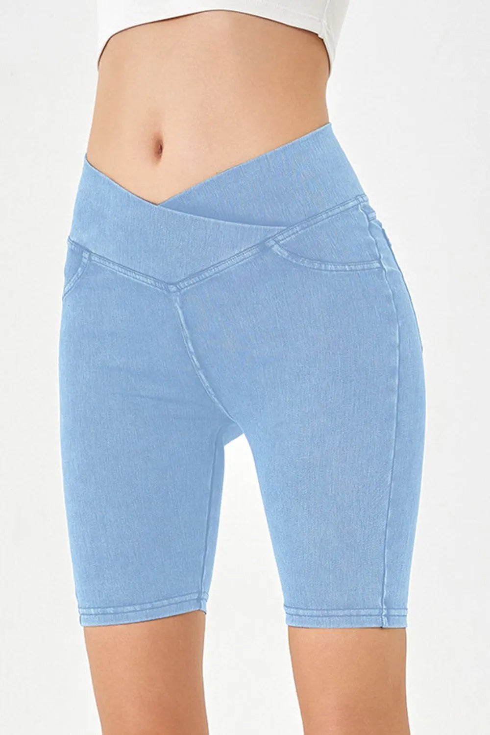 Light blue denim shorts on a white background