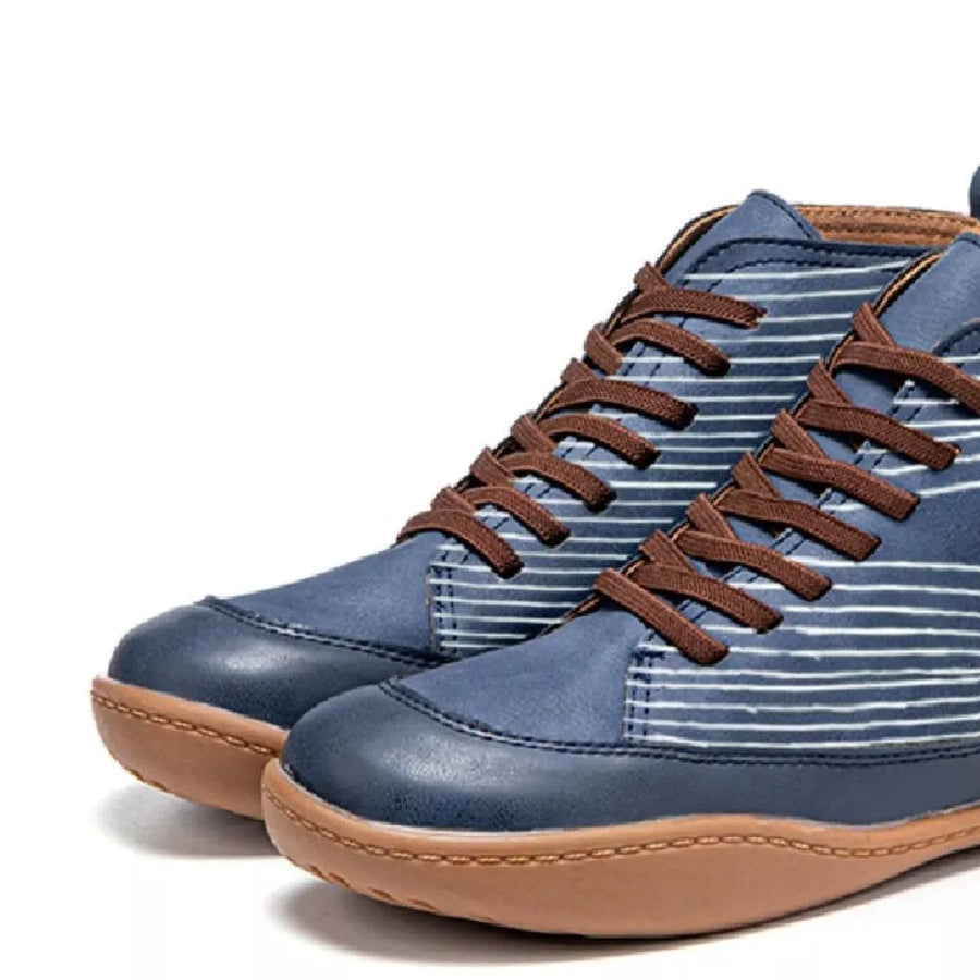 Blue high-top sneakers with brown accents on a white background