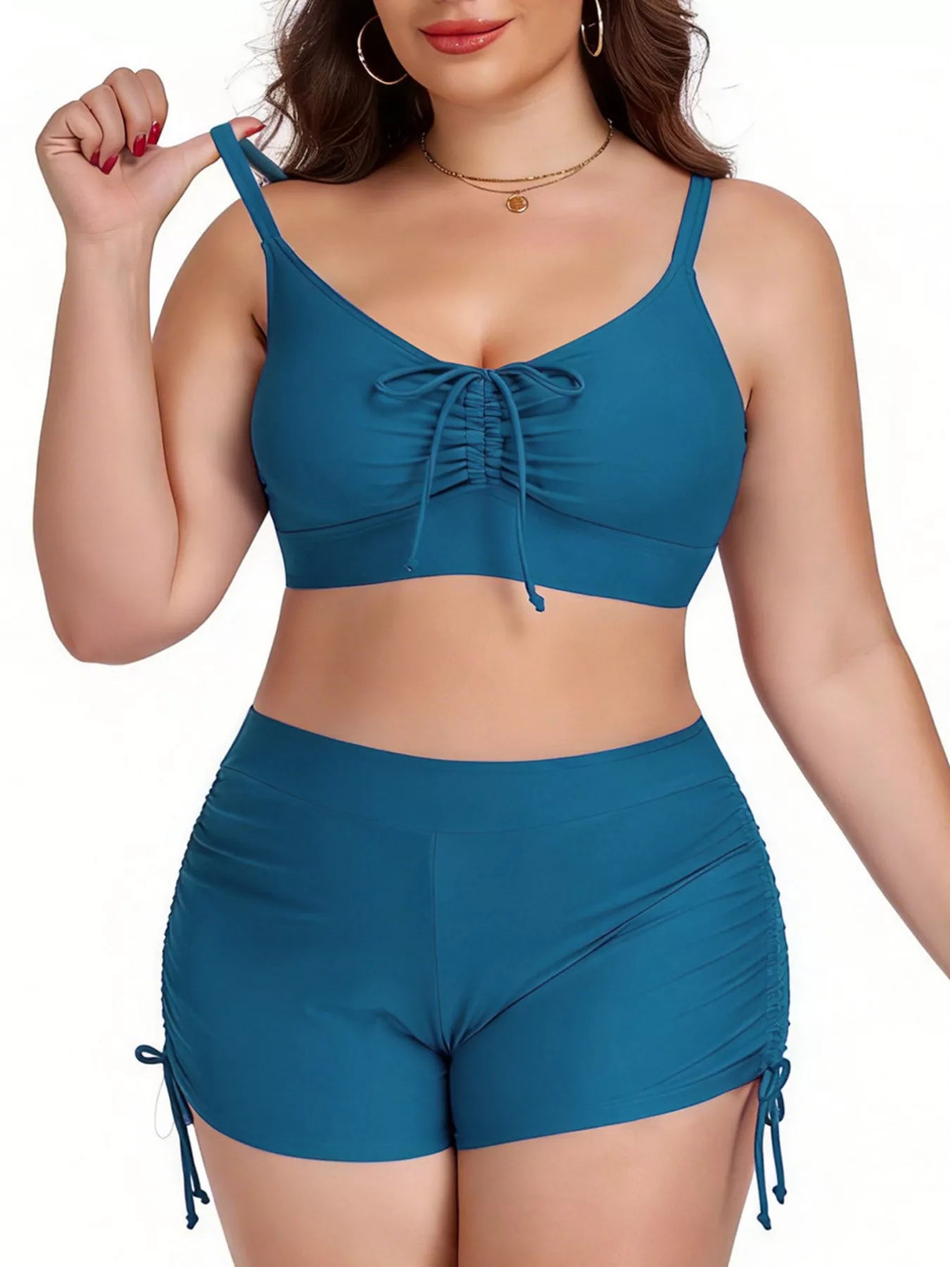 Woman wearing a blue bikini set on a white background
