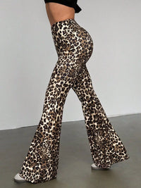 Leopard print flared pants worn by a person on a plain background