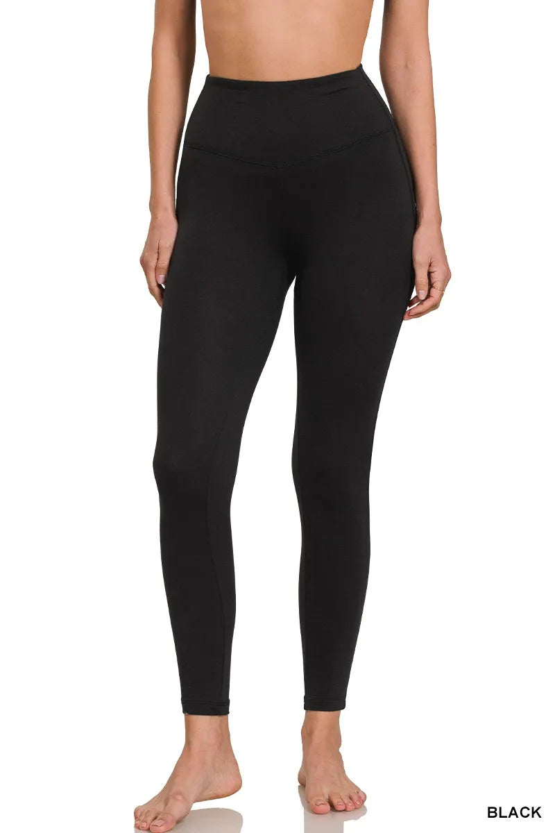 Black leggings worn by a person on a white background