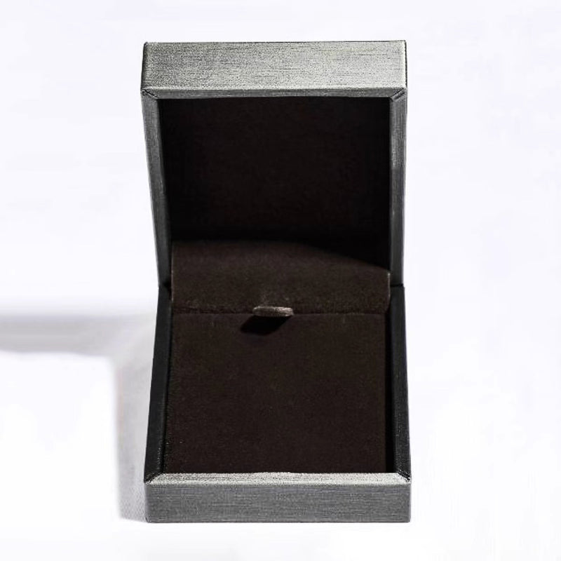 Black ring box with a silver rim on a white background
