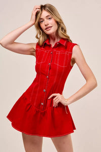 Woman wearing a red dress with a beige background